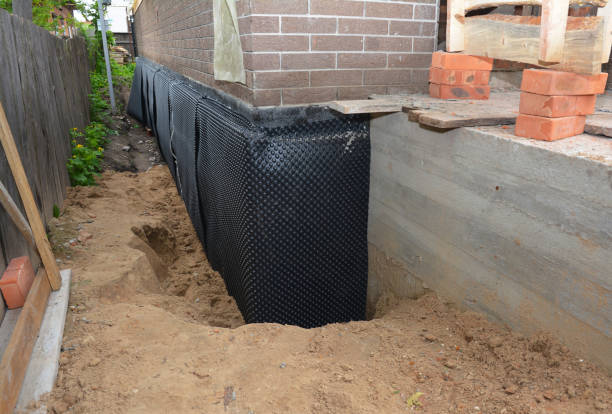 SJ Waterproofing Pros technician performing targeted Interior Drainage System assessment in Joppa, AL
